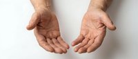 Male hands with open palms in giving or receiving gesture on white background, isolated for design use in charity and help concepts.