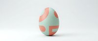 Decorative Easter egg with modern geometric pattern in soft mint green and coral pink colors on white background for spring holiday celebrations.