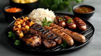 Grilled sausages and meat assortment on black plate with rice, roasted vegetables and dipping sauces, garnished with fresh herbs and spices.