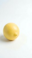 Fresh yellow lemon isolated on white background for culinary and healthy lifestyle designs.