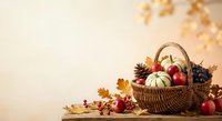 Autumn harvest basket with pumpkins, apples and pine cones on wooden table with fall leaves. Seasonal thanksgiving decoration for holiday marketing materials.