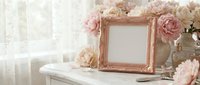Elegant rose gold picture frame surrounded by soft pink peonies on white dresser creating romantic feminine home decor mockup for wedding photography display.
