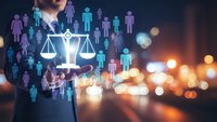 Businessman holding glowing justice scales with diverse people icons representing legal equality, human rights, and fair employment practices in corporate law.