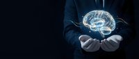 Businessman in dark suit holding glowing digital brain hologram in cupped hands against black background for artificial intelligence and neuroscience concepts.