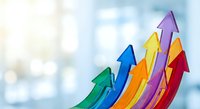 Colorful upward arrows showing business growth, success and progress with bright office background for financial presentations and marketing materials.