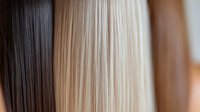 Contrasting straight hair strands in dark brown and light blonde colors showing different hair dye shades and highlighting techniques for salon and beauty industry use.