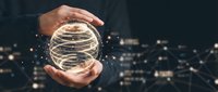 Male hand holding glowing sphere with digital network lines against blurred city lights, representing technology, innovation, and global connectivity for business concepts.