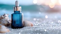Blue glass dropper bottle with seashells on sparkling sand against blurred ocean background, luxury skincare and beauty product photography with bokeh light effects.