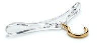 Crystal clear glass shoe horn with elegant gold metal hook, isolated on white background. Luxury accessory for dressing room or boutique display.
