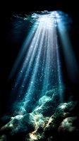 Ethereal sunbeams pierce through crystal clear ocean water, illuminating rocky seafloor with magical aqua glow while suspended particles sparkle like underwater stars.