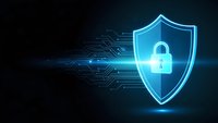 Glowing blue cybersecurity shield with padlock icon and circuit board patterns on dark background for digital protection and data security concepts.