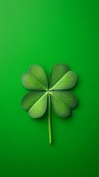 Four-leaf clover on vibrant green background with detailed leaf veins and texture, symbol of luck and Irish culture, isolated for design projects and holiday graphics.