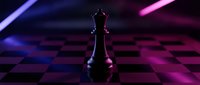 Black chess king piece standing on checkered board with dramatic purple and pink neon lighting creating futuristic gaming atmosphere for strategic concepts.