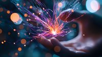 Magical glowing light particles floating above open palm with vibrant purple and blue energy streams creating ethereal atmosphere against dark background.