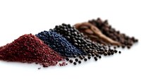 Colorful spice collection with red chili flakes, black peppercorns, cinnamon sticks and coffee beans arranged in diagonal line on white background.