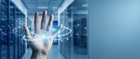 Hand reaching toward glowing digital network connections in modern data center server room representing cloud computing and technological innovation.
