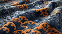 Decorative waves pattern in navy blue and orange with traditional Asian motifs and swirls creates dynamic flowing texture on fabric surface.