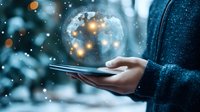Professional businessman holding tablet with glowing digital globe and network connections representing global technology and business innovation.
