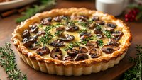 Savory mushroom quiche with golden crust and fresh herbs, served on wooden board for gourmet brunch or dinner party.