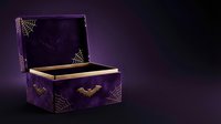 Purple ornate jewelry box with golden interior and decorative bat motifs on dark gradient background for luxury product photography and Halloween themes.