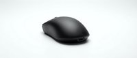 Black wireless computer mouse isolated on white background, sleek ergonomic design for office and gaming use, modern peripheral device.