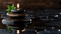 Burning candle on wet black spa stones with green leaves and water drops, creating peaceful reflection on dark background. Wellness and relaxation concept.