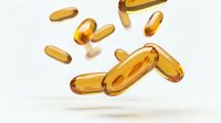 Golden omega-3 fish oil capsules floating in air on white background. Dietary supplements for health and wellness nutrition isolated for design use.