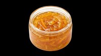 Open glass jar filled with golden orange marmalade, isolated on transparent background. Ready for food packaging, stickers, clipart, print on demand, and T-shirt design use.