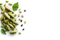 Fresh green cardamom pods scattered with seeds and leaves on white background, isolated spice composition for culinary and aromatic designs.