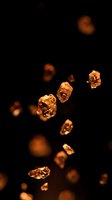 Floating golden amber crystals and gemstones suspended against dark background, suitable for luxury, jewelry, and premium product design projects.
