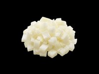 Diced white onion pieces isolated on transparent background, ready for culinary design, recipe graphics, food packaging, cooking blogs, restaurant menus, and print-on-demand kitchen products.