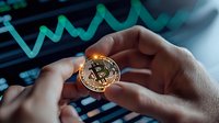 Golden cryptocurrency coin held in hands against digital trading chart background, showcasing financial technology and digital currency investment trends.