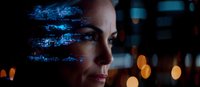 Profile view of woman with glowing blue digital effects and bokeh lights in dark background, representing artificial intelligence and future technology integration.