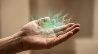Mature male hand holding glowing green holographic cityscape with digital buildings and light effects, representing technology, innovation, and sustainable urban development for business concepts.