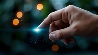 Magical glowing light effect between fingers against dark bokeh background, creating mystical and ethereal atmosphere for fantasy and spiritual concepts.