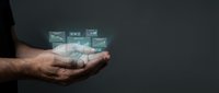 Business analytics holographic data visualization floating above open palm showing charts graphs and financial metrics for digital transformation presentations.