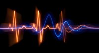 Glowing neon sound wave pulse with orange and blue light effects on black background for music technology and audio visualization projects.