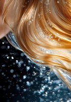 Flowing blonde hair with water droplets and bubbles against dark blue background creates dynamic movement and contrast in beauty and hair care concept.