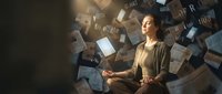 Young Asian woman meditating peacefully surrounded by floating books and papers in warm lighting for mindfulness education and learning concepts.