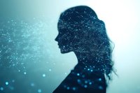 Silhouette of woman with flowing hair filled with cosmic stars and glowing particles against teal background, representing mind, consciousness and inner universe.