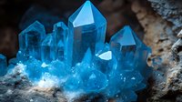 Stunning blue crystal cluster formation with geometric faceted points emerging from natural rock matrix for geology and mineral collection displays.