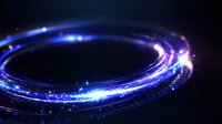 Glowing blue light trails forming luminous spiral ring with sparkles and particles on dark background, creating magical energy effect.