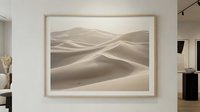 Serene desert sand dunes landscape artwork in wooden frame displayed on modern gallery wall creating peaceful minimalist home decor atmosphere.