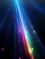 Vibrant light beams in rainbow colors pierce through dark space with glowing particles and stars creating magical atmospheric effect for backgrounds and designs.