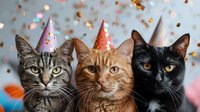 Three cats wearing party hats with colorful confetti falling in background, celebrating a festive occasion against blurred bokeh lights.