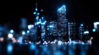Blurred city skyline at night with illuminated skyscrapers and bokeh lights creating dreamy urban atmosphere for business and technology concepts.