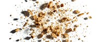 Scattered particles of crushed cork, wood chips, and dark debris exploding outward on white background, suitable for design overlays, compositing, and creative projects.