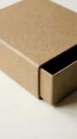 Brown cardboard box with sliding drawer partially open on neutral background for packaging and shipping applications.