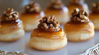 Golden puff pastry shells filled with rich caramel and topped with crunchy walnuts, gourmet dessert appetizers for elegant entertaining and special occasions.