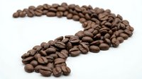 Roasted coffee beans arranged in curved wave pattern on white background isolated for cafe branding and beverage marketing designs.